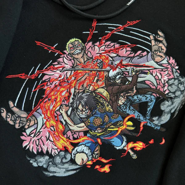 Dressrosa Showdown: Doflamingo vs. Luffy and Law Embroidered Hoodie.